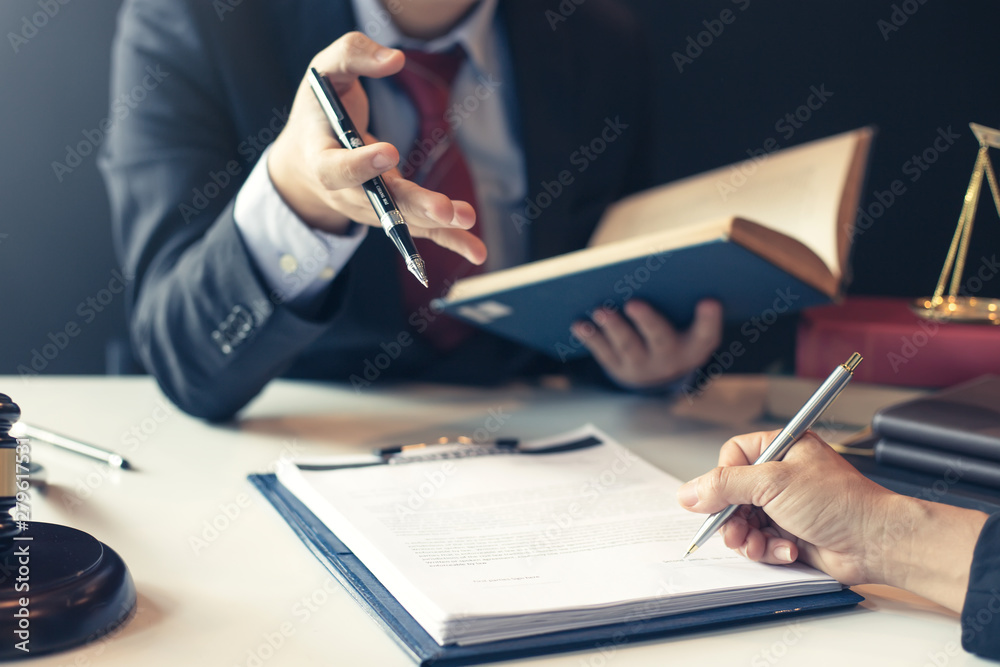 Businessman and lawyer discuss the contract document. Treaty of the law. Sign a contract business.