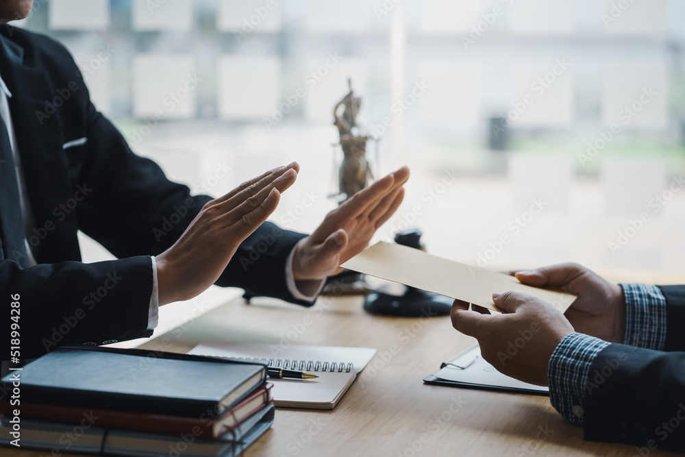 Lawyer refuses to accept bribe from business people in contracting. Corruption and anti bribery concept.